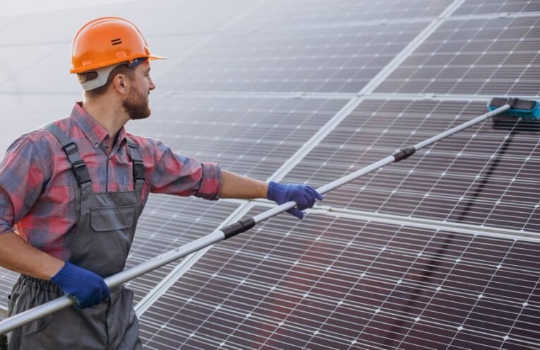 Dust-covered solar panels in desert environment Technician cleaning utility-scale solar farm Graph showing thermal derating impact on solar efficiency Cooling system installed on photovoltaic panels Drone inspection of solar farm in arid region Robotic cleaning technology for solar panels Steelbridge Export logo with solar equipment Solar panels with sand accumulation before cleaning Heat map showing temperature coefficient effect on solar panels Optimized solar panel array in Middle Eastern desert