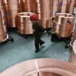 High-purity copper cathodes stacked for export, symbolizing growth in copper export and global supply trends for 2025.