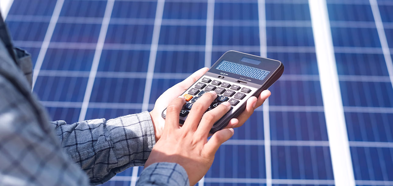 Solar panels and fossil fuel power plants comparison highlighting cost differences in 2025.