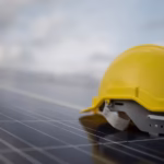 Private equity investment driving large-scale solar construction projects with panels and cranes on site.