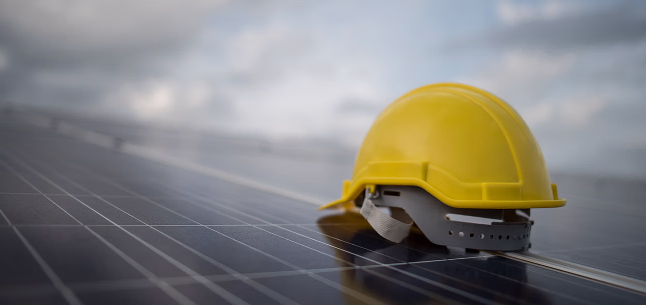 Private equity investment driving large-scale solar construction projects with panels and cranes on site.