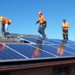 "Solar EPC construction site during the energy transition, with photovoltaic panels being installed for a large-scale infrastructure investment."