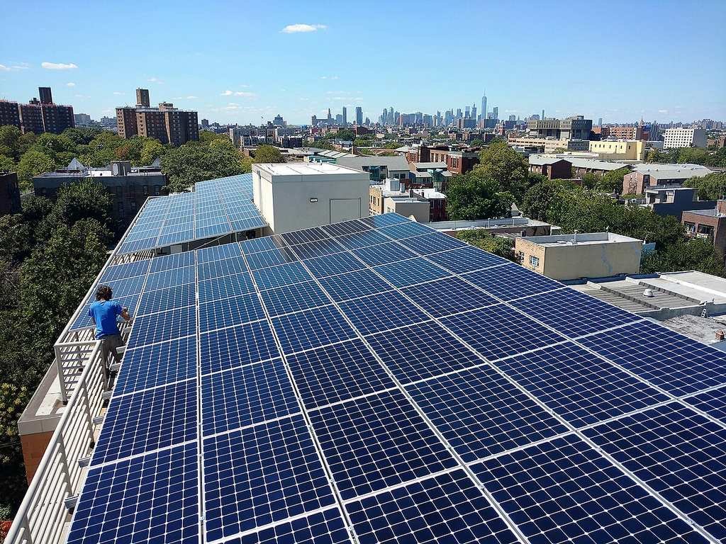 Photovoltaic system installation in an emerging market solar farm with clear skies.