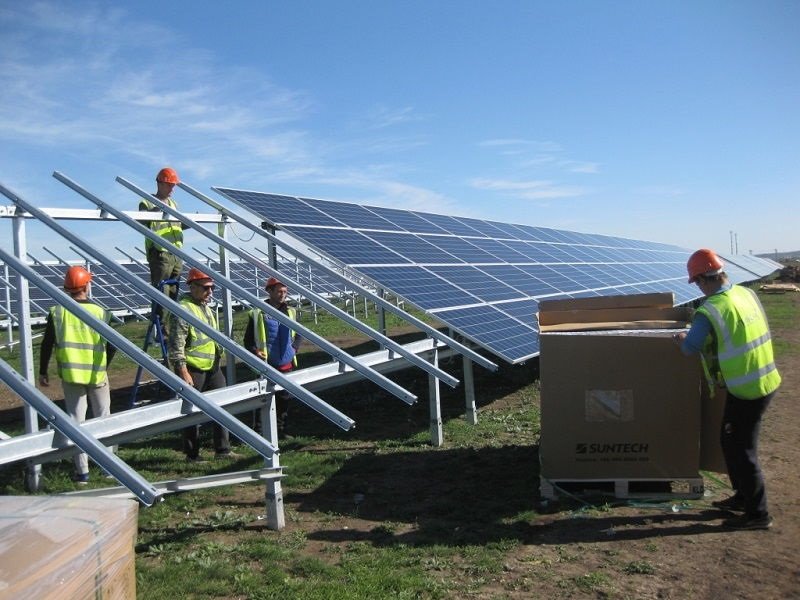 Utility-scale solar PV panels integrated into modern urban infrastructure design.