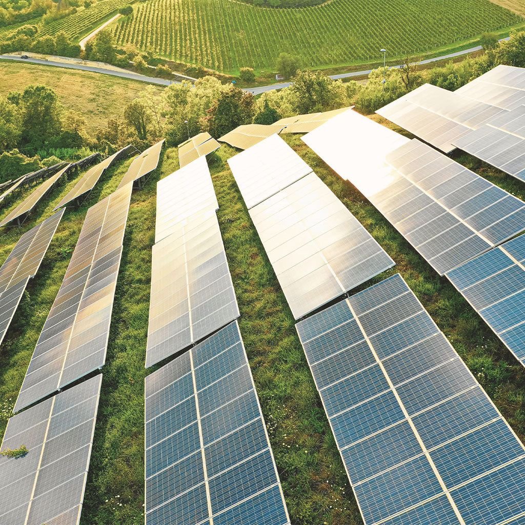 Industrial solar panels in a desert environment showcasing efficiency optimization and sustainable green investment.